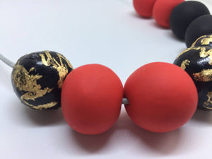 Nine Angels Black, red & gold leaf necklace