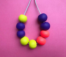Load image into Gallery viewer, Nine Angels Neon yellow, orange &amp; purple clay necklace
