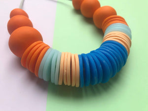 Nine Angels Orange, peach, ice blue and royal blue statement necklace