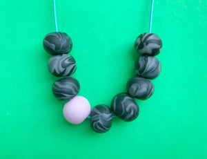 Nine Angels Pale pink & black clay bead necklace