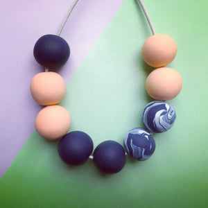 Nine Angels Peach & navy marbled polymer clay necklace