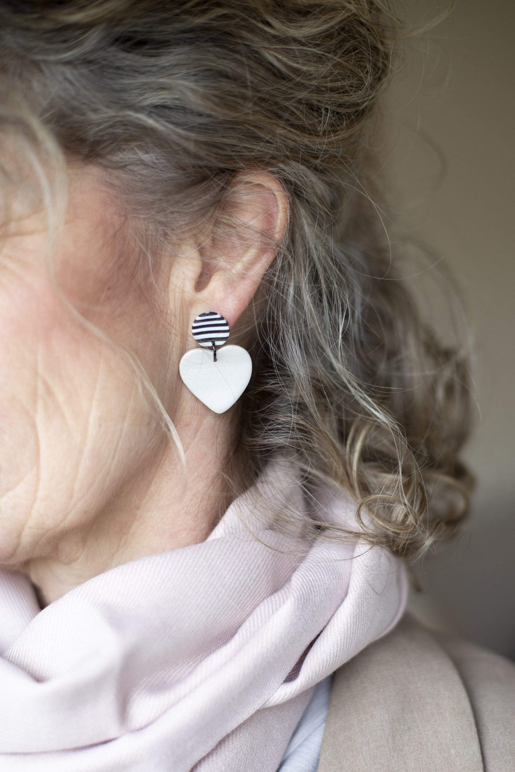 Nine Angels Pearlescent white and stripe heart earrings