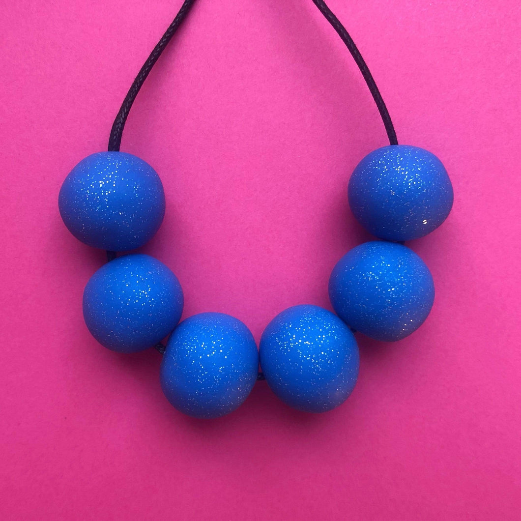 Nine Angels Royal blue sparkly necklace