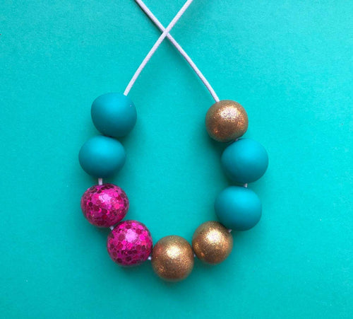 Nine Angels Sparkly pink, gold & jade green necklace