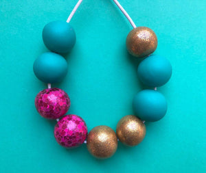 Nine Angels Sparkly pink, gold & jade green necklace