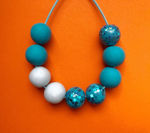 Nine Angels Sparkly turquoise clay necklace